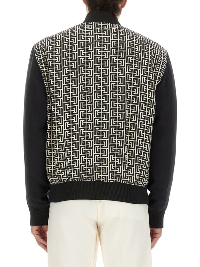 Balmain MONOGRAMMED VARSITY JACKET WITH PATCHES