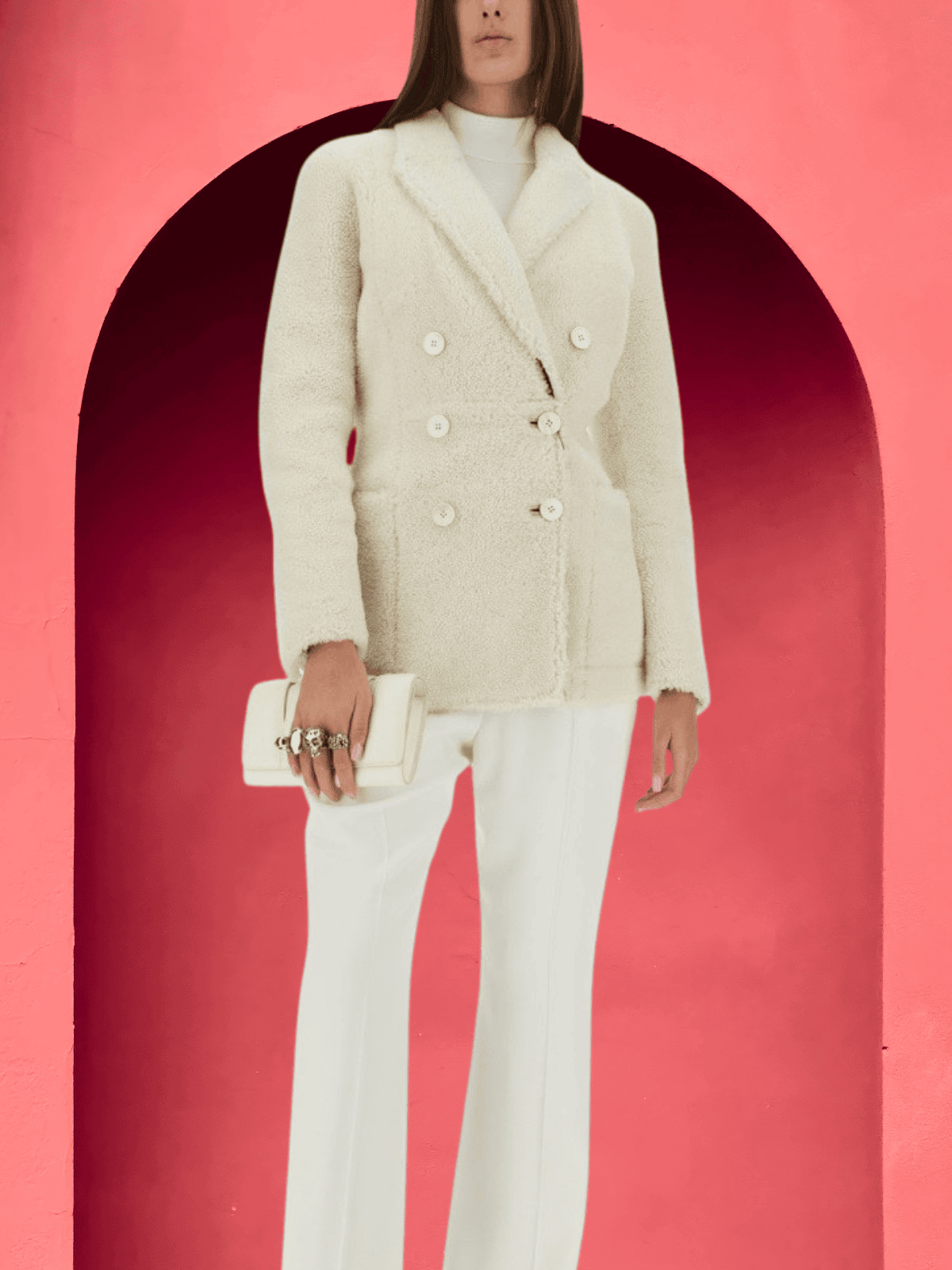 Model in structured cream wool blazer and trousers holding a clutch – Alexander McQueen women's collection.