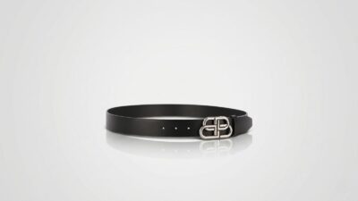 Balenciaga black smooth leather belt featuring a silver-tone interlocked BB logo buckle for THE WISHLINE luxury men's belts collection navigation.