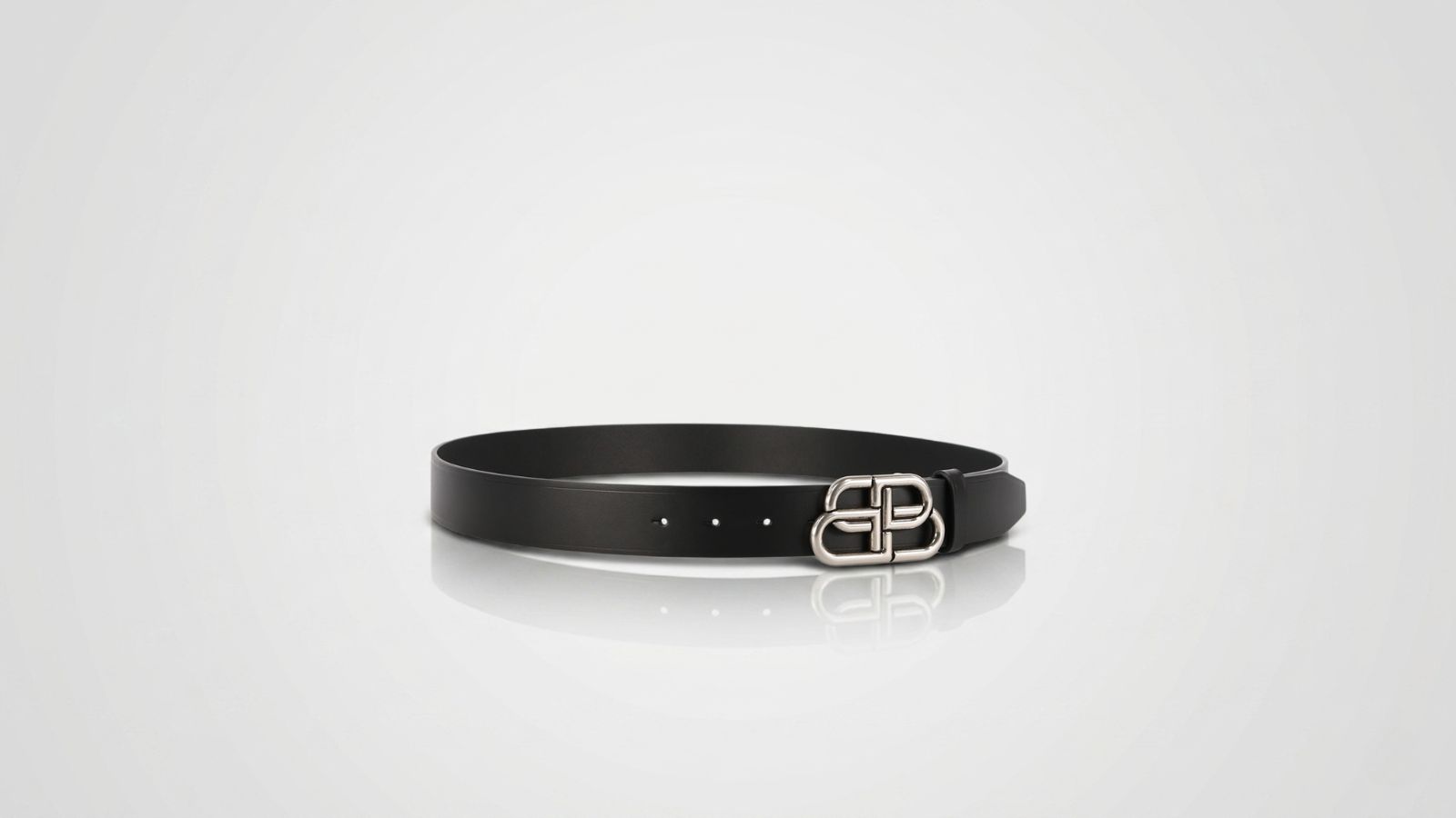 Balenciaga black smooth leather belt featuring a silver-tone interlocked BB logo buckle for THE WISHLINE luxury men's belts collection navigation.