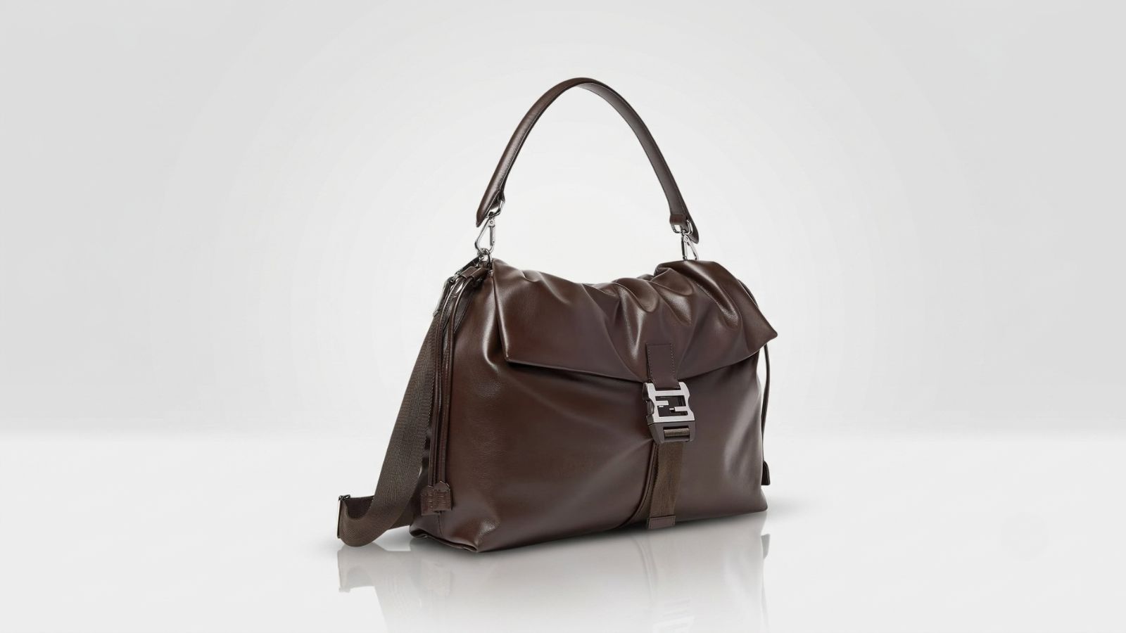 Fendi dark brown smooth leather slouchy shoulder bag featuring an adjustable strap and a silver-tone signature FF logo buckle closure for THE WISHLINE luxury men's crossbody and shoulder bags collection navigation.