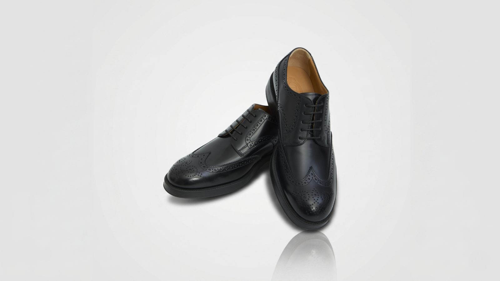 Tod's black patent leather formal derby dress shoes with lace-up closure for THE WISHLINE luxury men's lace-ups collection navigation.