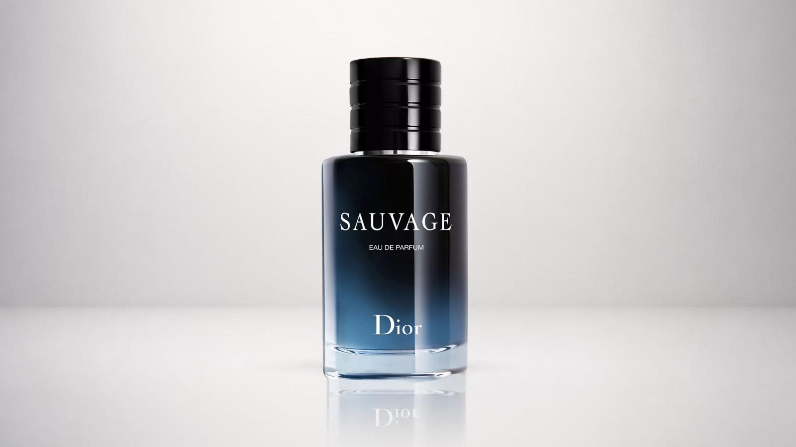 Dior Sauvage Eau de Parfum bottle featuring its signature midnight blue gradient glass and black magnetic cap for THE WISHLINE luxury men's parfum and fragrance collection navigation.