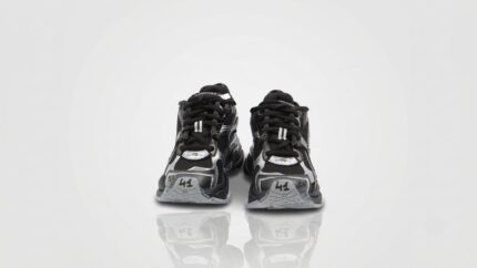Balenciaga black and metallic silver mesh Runner sneakers featuring the signature size embroidery on the toe cap for THE WISHLINE luxury men's sneakers collection navigation.