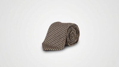 Tom Ford beige and black silk jacquard necktie featuring an intricate woven geometric chevron pattern for THE WISHLINE luxury men's ties and formal accessories collection navigation.