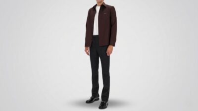 Charcoal grey tailored trousers paired with a dark brown button-up overshirt, a white crewneck t-shirt, and black leather horsebit loafers for THE WISHLINE luxury men's trousers and smart-casual pants collection navigation.