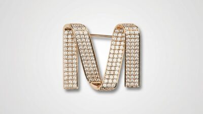 Max Mara crystal-embellished gold-tone 'M' logo brooch pin for THE WISHLINE designer women's assorted jewellery collection navigation.
