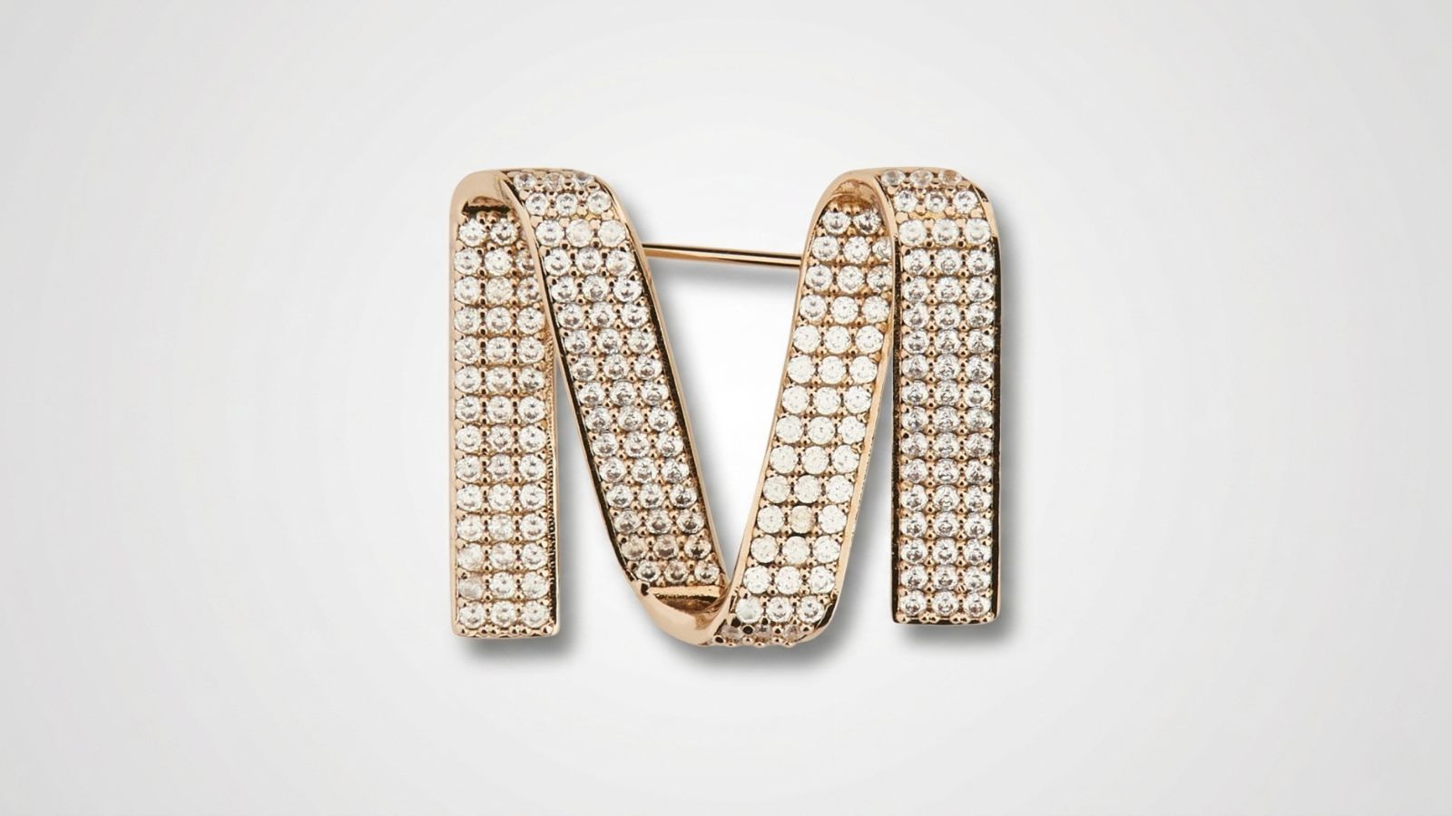 Max Mara crystal-embellished gold-tone 'M' logo brooch pin for THE WISHLINE designer women's assorted jewellery collection navigation.