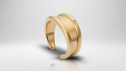 Dior minimal chunky gold cuff bracelet featuring a wide engraved band for THE WISHLINE luxury women's bracelets collection navigation.