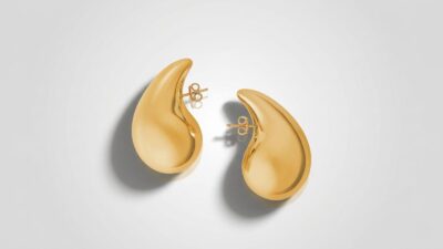 Bottega Veneta large yellow gold-finished drop earrings featuring an organic sculptural teardrop shape for THE WISHLINE luxury women's earrings collection navigation.