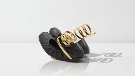 Luxury black leather ballerina flats featuring an iconic gold coil snake ankle wrap detail for THE WISHLINE designer flats and ballerinas navigation.