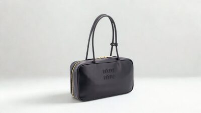 Miu Miu Arcadie black leather top-handle handbag on a neutral background for THE WISHLINE designer handbags collection navigation.