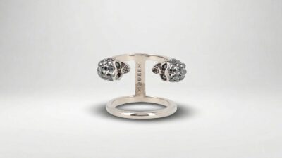 Alexander McQueen silver multi-finger ring featuring an oversized polished metal design for THE WISHLINE luxury women's rings collection navigation.