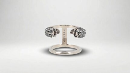 Alexander McQueen silver multi-finger ring featuring an oversized polished metal design for THE WISHLINE luxury women's rings collection navigation.