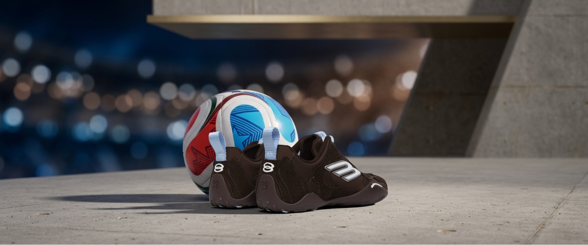 Luxury women's Balenciaga sneakers resting on a white and gold soccer ball, set on a modern concrete stadium suite floor overlooking a blurred soccer pitch illuminated by evening lights under a twilight sky.