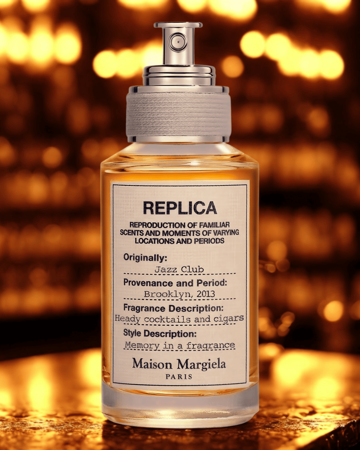 Maison Margiela Replica Jazz Club perfume bottle on bar counter with warm amber lighting, evoking rich notes of rum, tobacco, and leather.