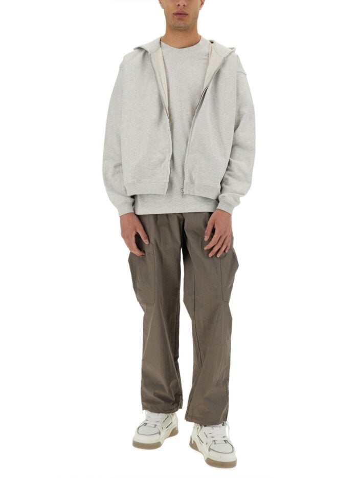 Represent "INITIAL" HOODED AND ZIPPERED SWEATSHIRT