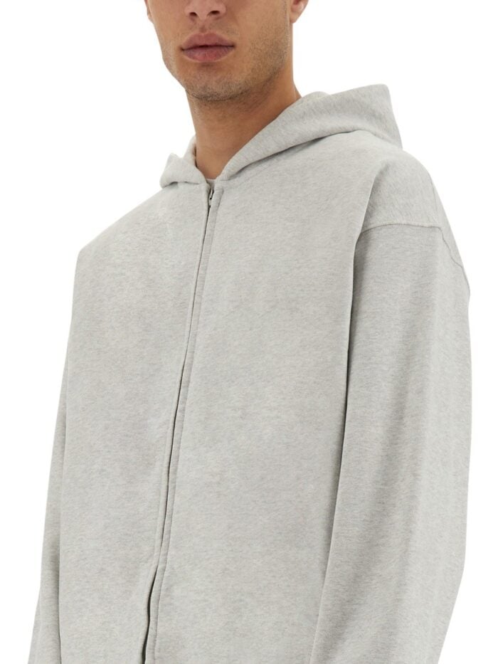 Represent "INITIAL" HOODED AND ZIPPERED SWEATSHIRT