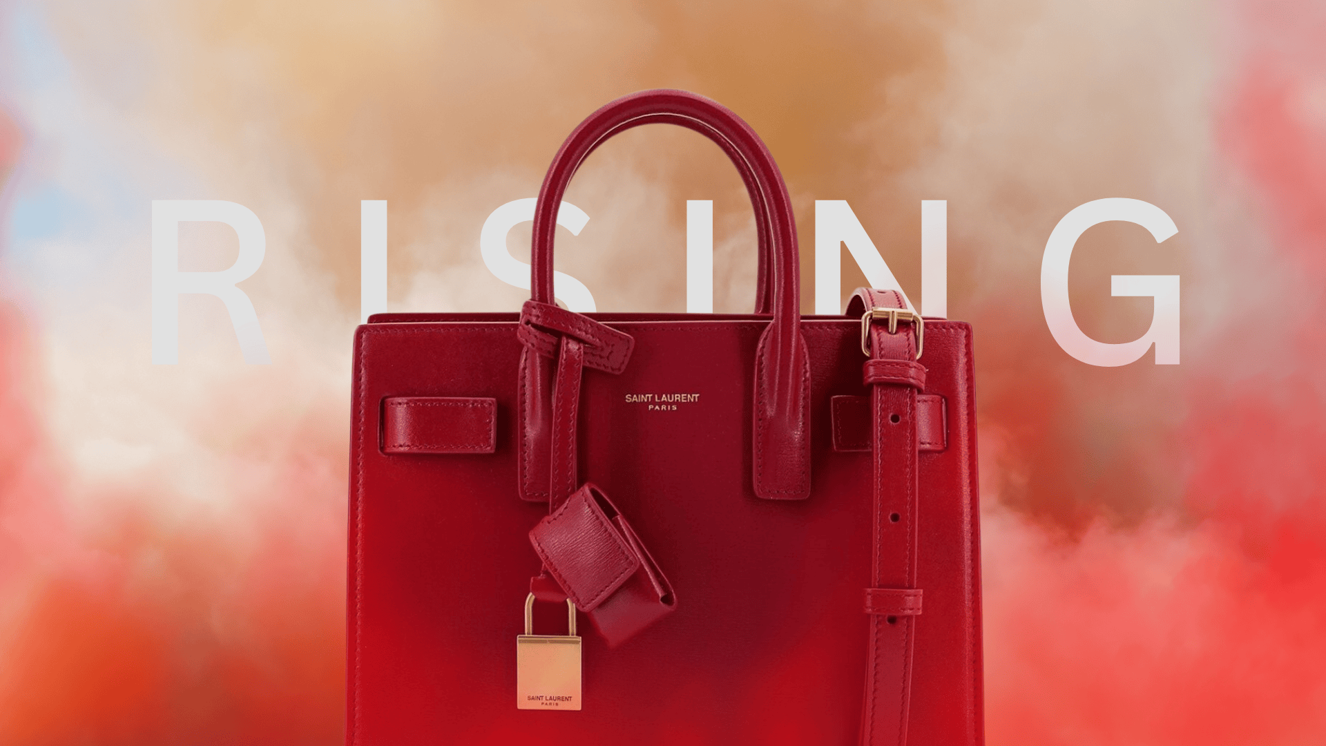 Saint Laurent red leather bag against a rising sandstorm background with the word 'RISING' in bold white letters.