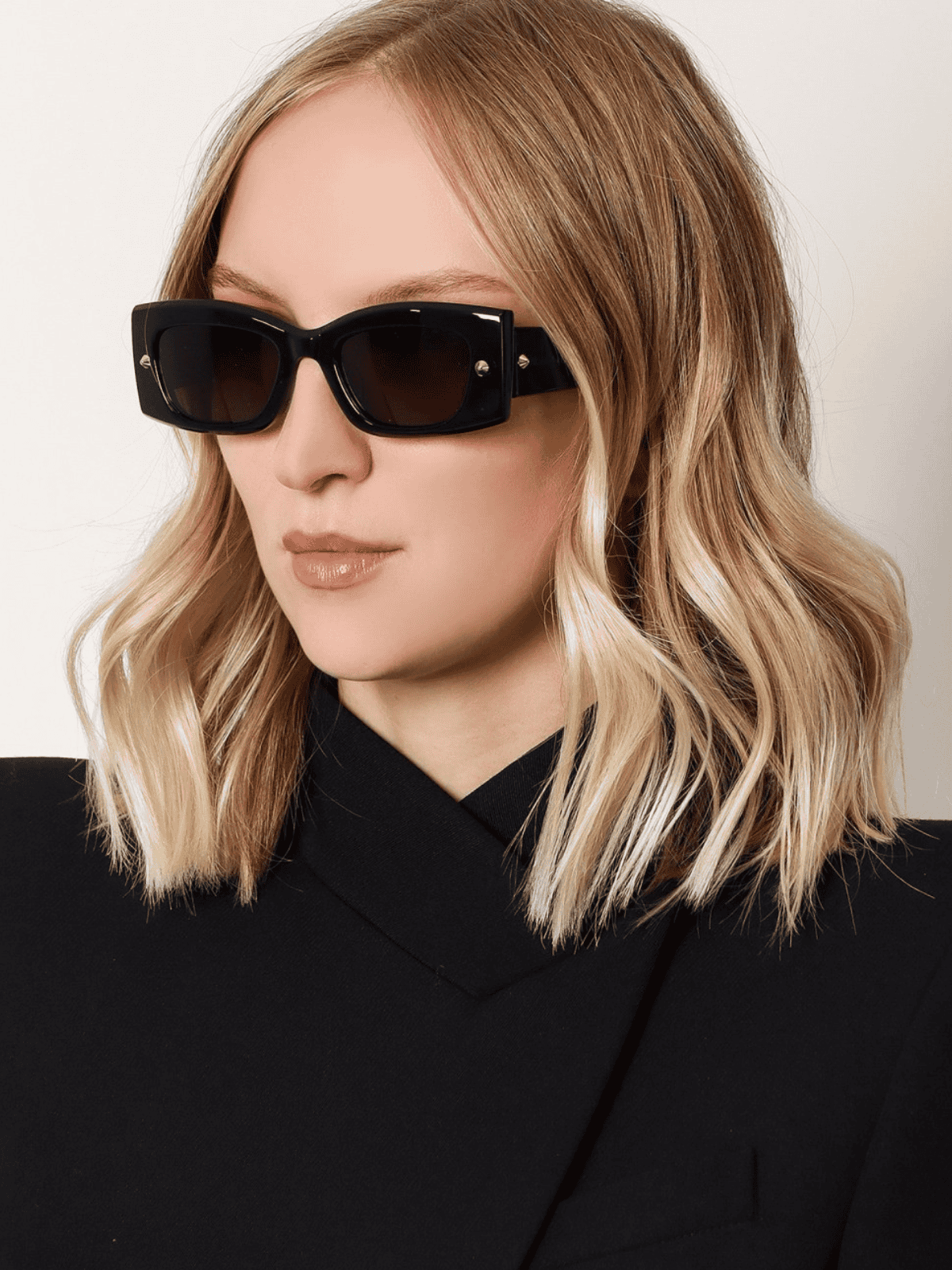 Woman model showcasing Alexander McQueen Sunglasses as part of THE WISHLINE Eyewear and Sunglasses Collection.